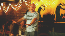 An animated Al on stage at the Comedy Club of Richmond.